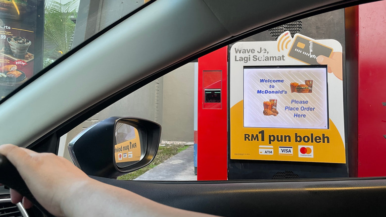 Person readying order at drive-thru