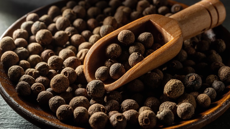 a bowl of allspice berries