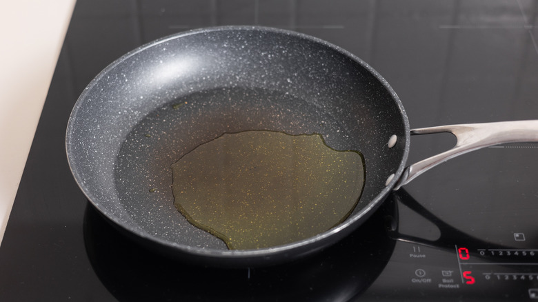 heating oil in skillet