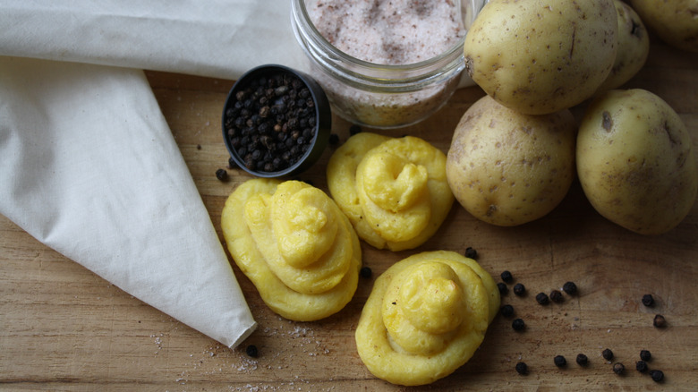 Piping bag and ingredients for duchess potatoes