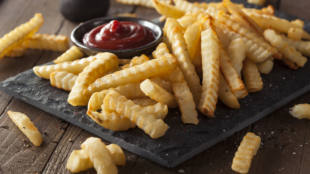 Crinkle cut fries with ketchup