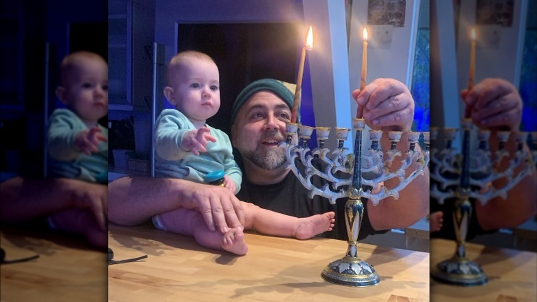 Duff Goldman and daughter Josephine lighting Hanukkah menorah