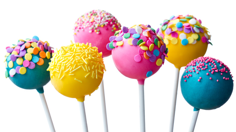 six brightly colored cake pops