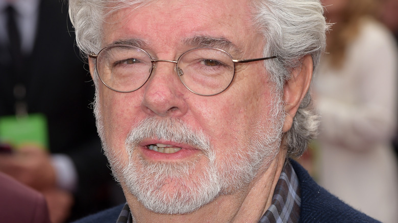 George Lucas wears glasses in close-up 