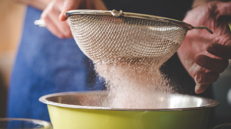 sifting flour for a cake