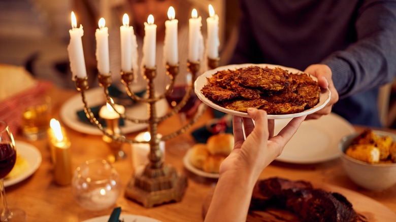 Latkes being passed