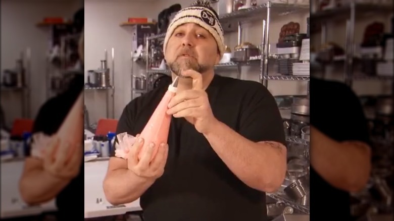 Duff Goldman holding piping bag