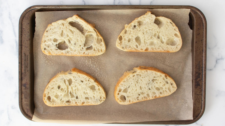 sliced bread on a baking pan