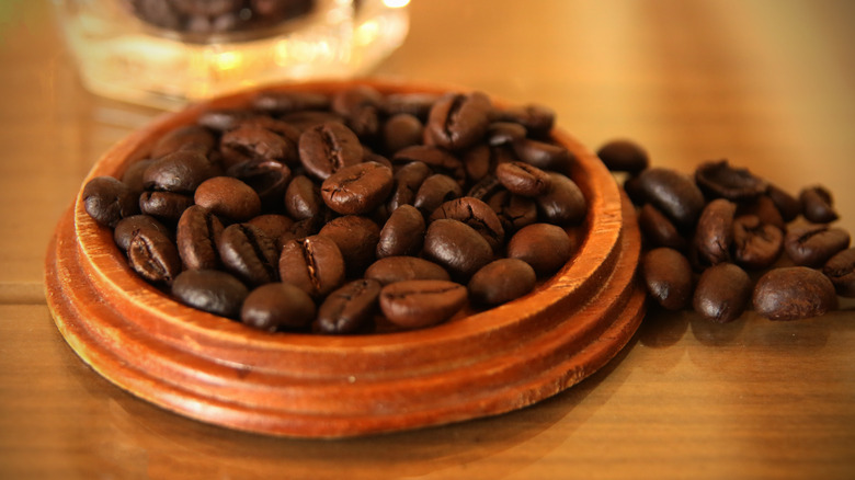 Coffee beans in wooden bowl