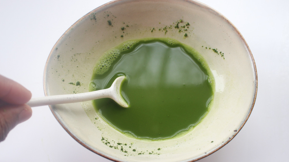 Matcha powder and hot water mixed for Dunkin' Donuts Frozen Matcha Latte copycat recipe