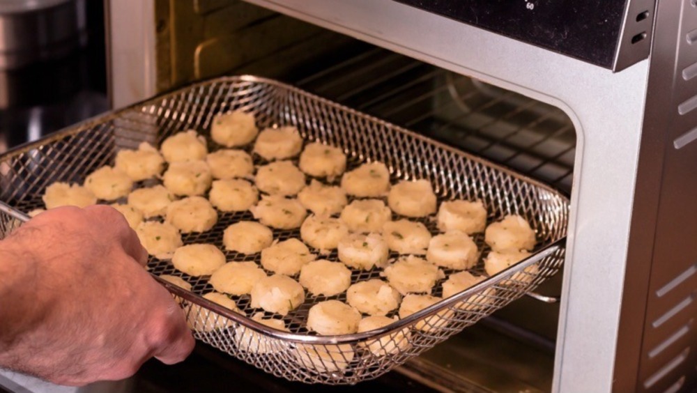 Placing hash browns in air fryer