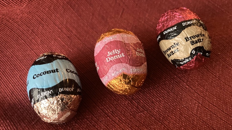 three wrapped Dunkin chocolates