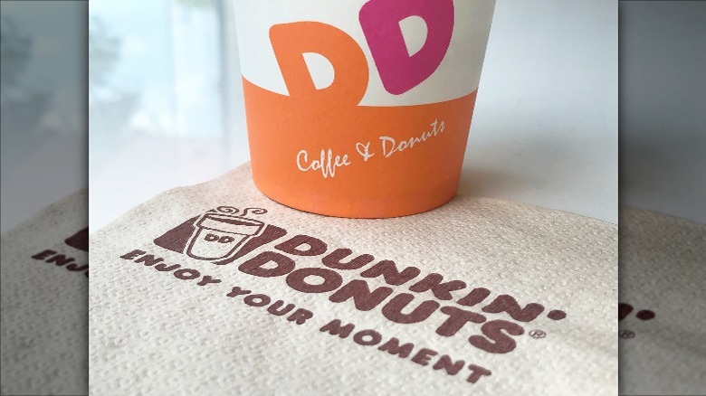 Dunkin' coffee cup and napkin