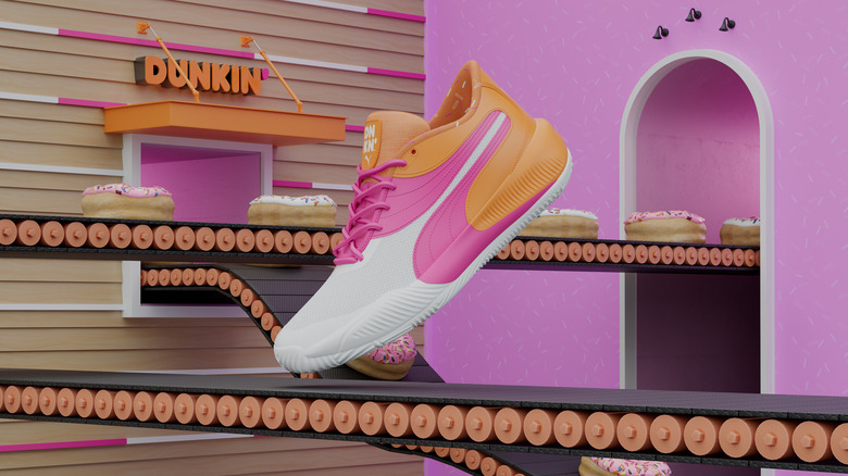 Orange, pink and white sneaker with donuts on conveyer belts and dunkin' logo in background