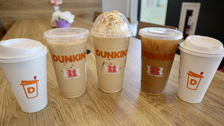 five Dunkin' drinks on table