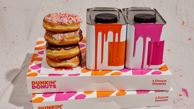 Dunkin' donuts and pink and orange paint cans on Dunkin' boxes