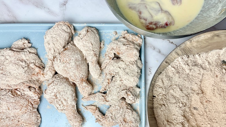 dredging the chicken in flour