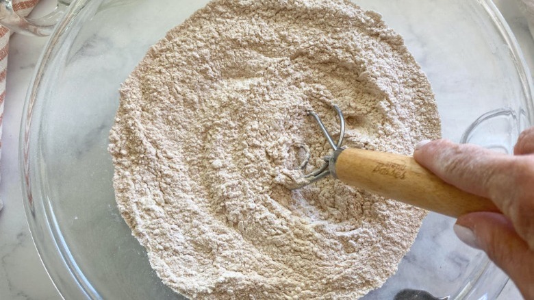 flour in bowl with whisk