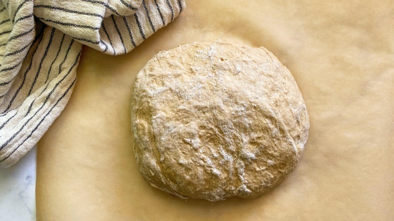 dough ball on parchment paper