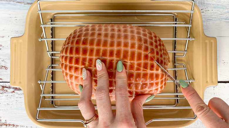 slicing the pre-cooked ham