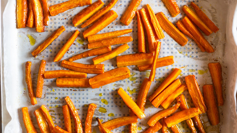 sliced roasted carrots on sheet pan