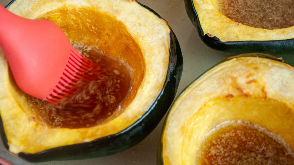 basting acorn squash with pastry brush