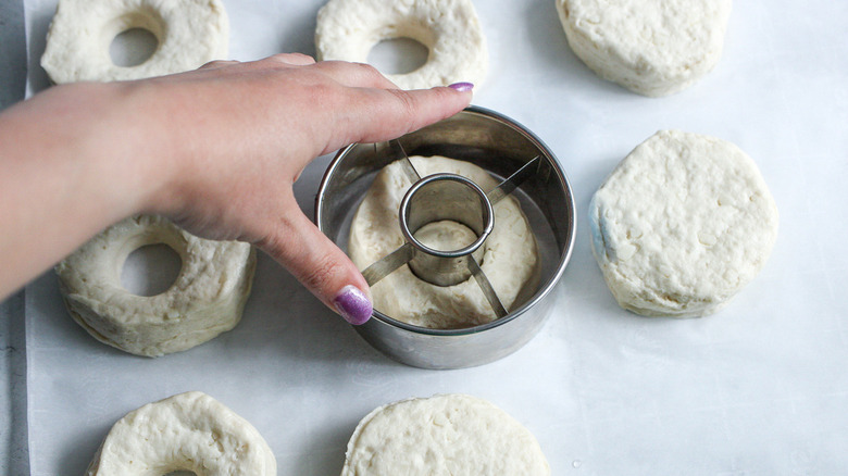 hand cutting biscuit dough