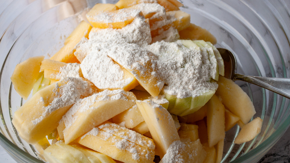 sliced apples covered in flour for easy apple pie