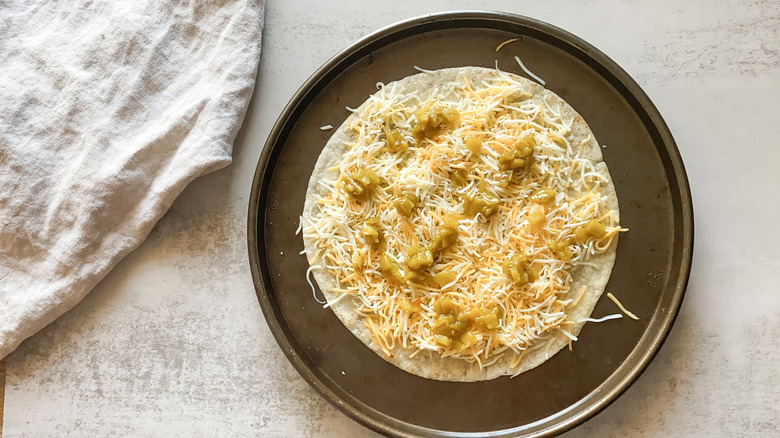 unbaked cheese crisp on pan