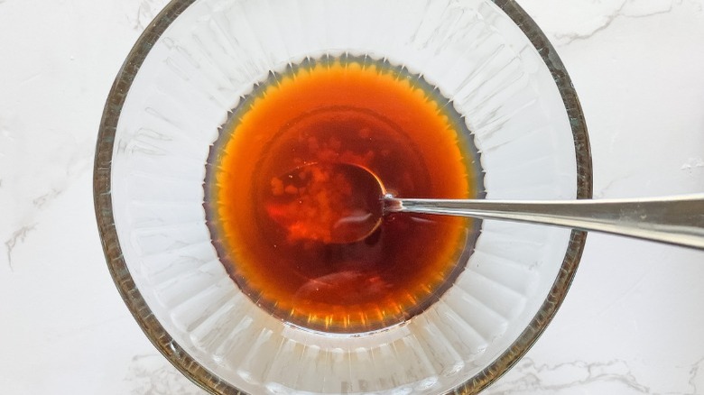 soy-based sauce in a clear bowl