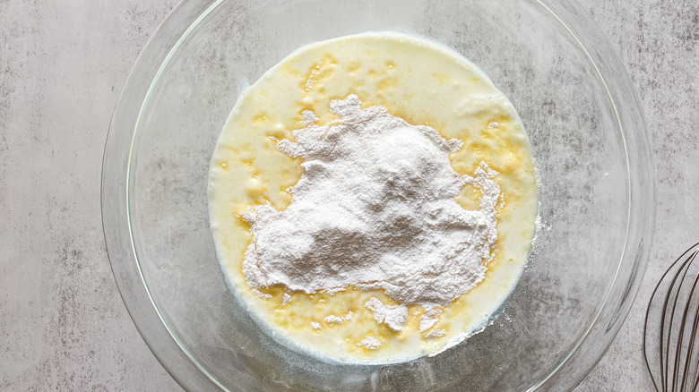 Pudding mix and milk inside a bowl