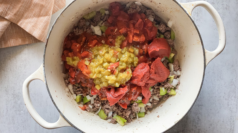 Beef, tomatoes, green chiles and beef in chili pot