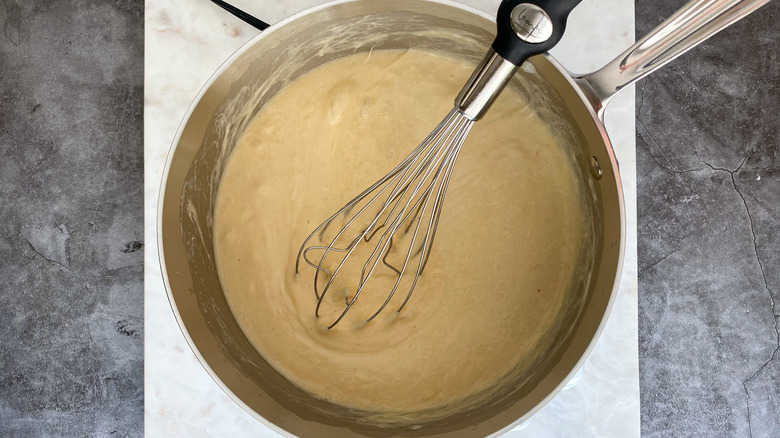 mustard-cheese mix in pot