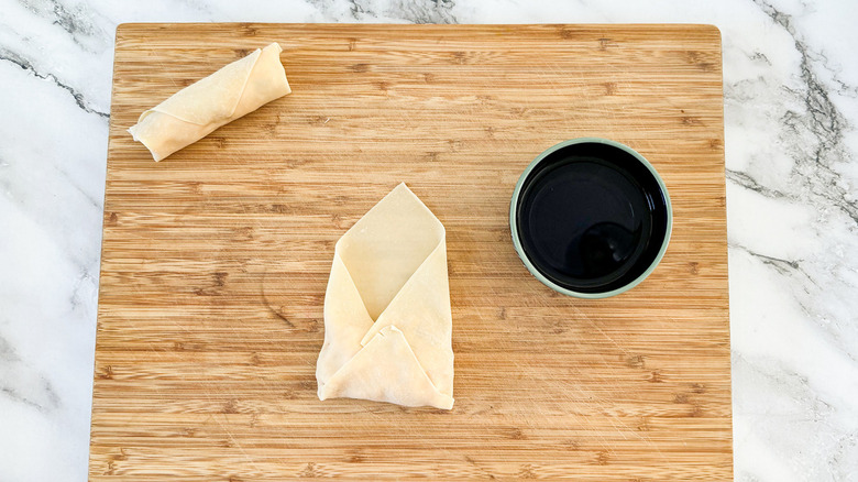 egg rolls on cutting board