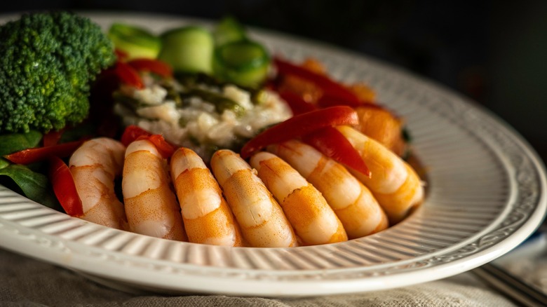 Plate of poached shrimp and vegetables