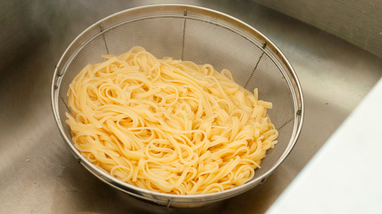 linguine draining in colander