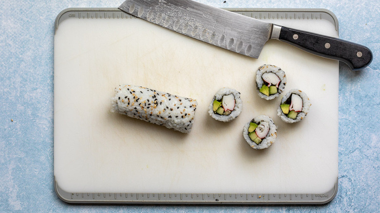 sliced California roll on cutting board