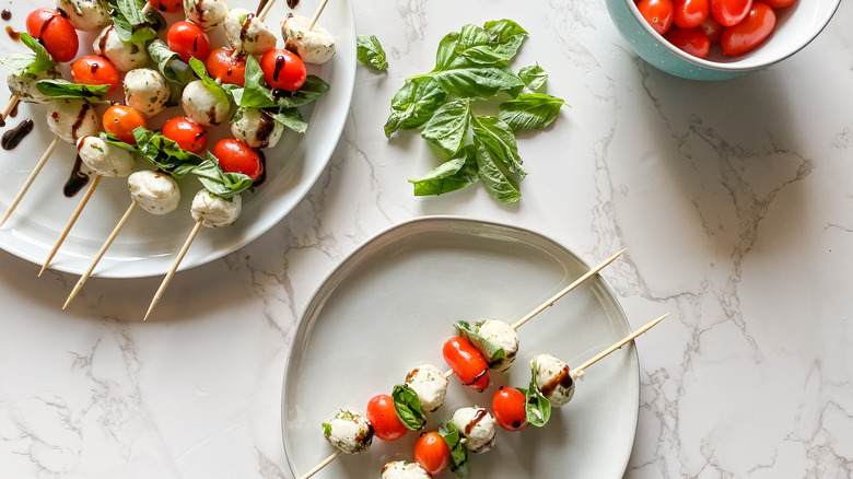 plates of caprese skewers