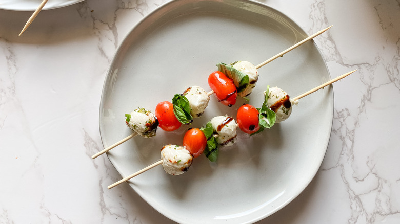 caprese skewers on a plate