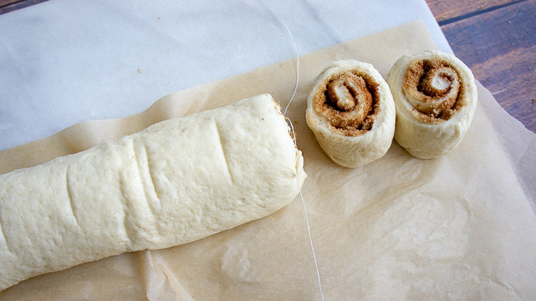 A log of dough rolled up with two rolls cut off on the end