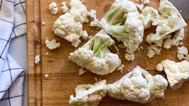 cauliflower florets on cutting board