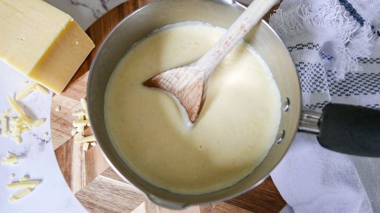 cheese sauce in pot 