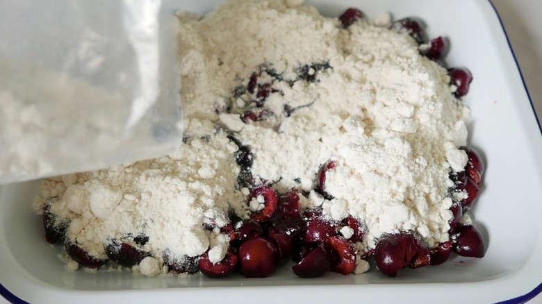 white cake mix on top of cherries