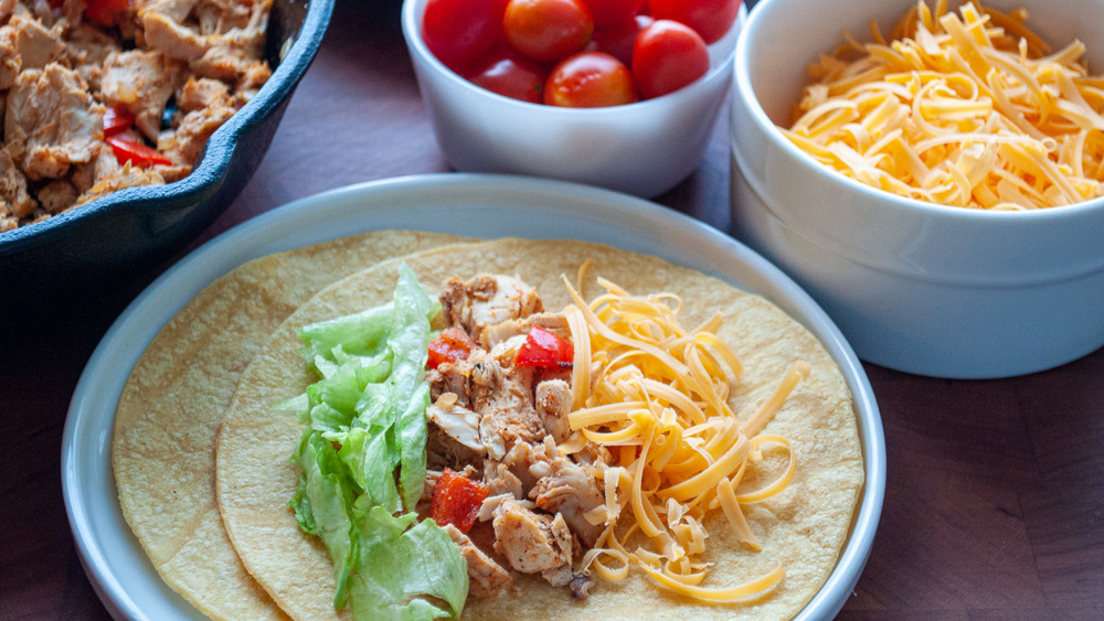 chicken tacos being built