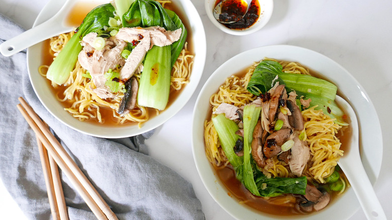 bowls of chinese chicken noodle soup