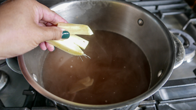 adding ginger to broth