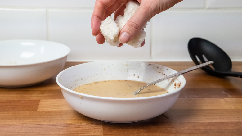 bread cubes into egg mixture