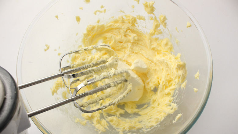 hand mixer in butter and cream cheese