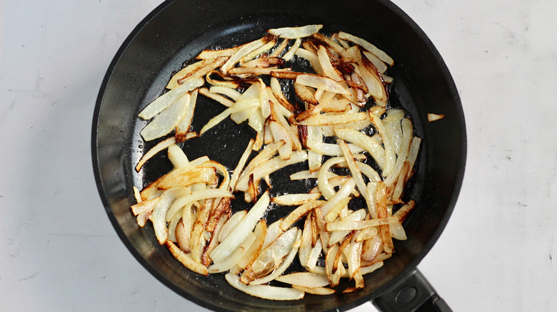 sliced onions cooked in pan