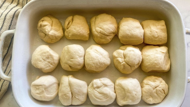 rolled dough in baking dish